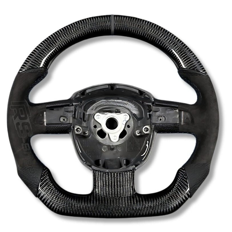 https://cdn.shopify.com/s/files/1/0727/0635/9572/files/Volant_Carbone_Blanc_A4_B7_alcantara_1.jpg?v=1770224215