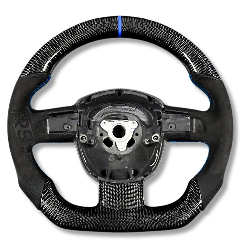 https://cdn.shopify.com/s/files/1/0727/0635/9572/files/Volant_Carbone_Bleu_A4_B7_alcantara_1.jpg?v=1770224215