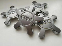 2x Centres de Roues Audi Étoiles 135mm Noir Chrome - vue de face - Becquet Voiture