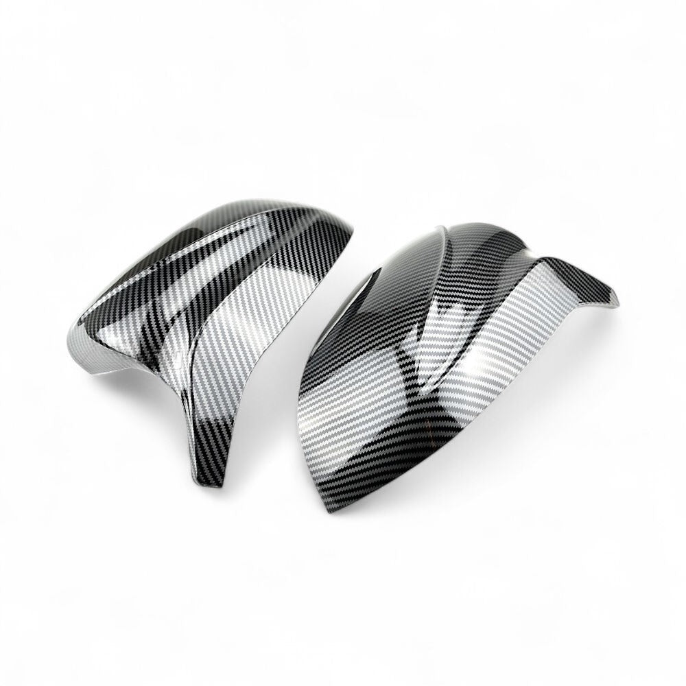 https://cdn.shopify.com/s/files/1/0565/4957/2747/files/Coques-de-retroviseurs-en-fibre-de-carbone-type-M-Performance-pour-BMW-X7-G07-2019-2025-11.jpg?v=1761604216