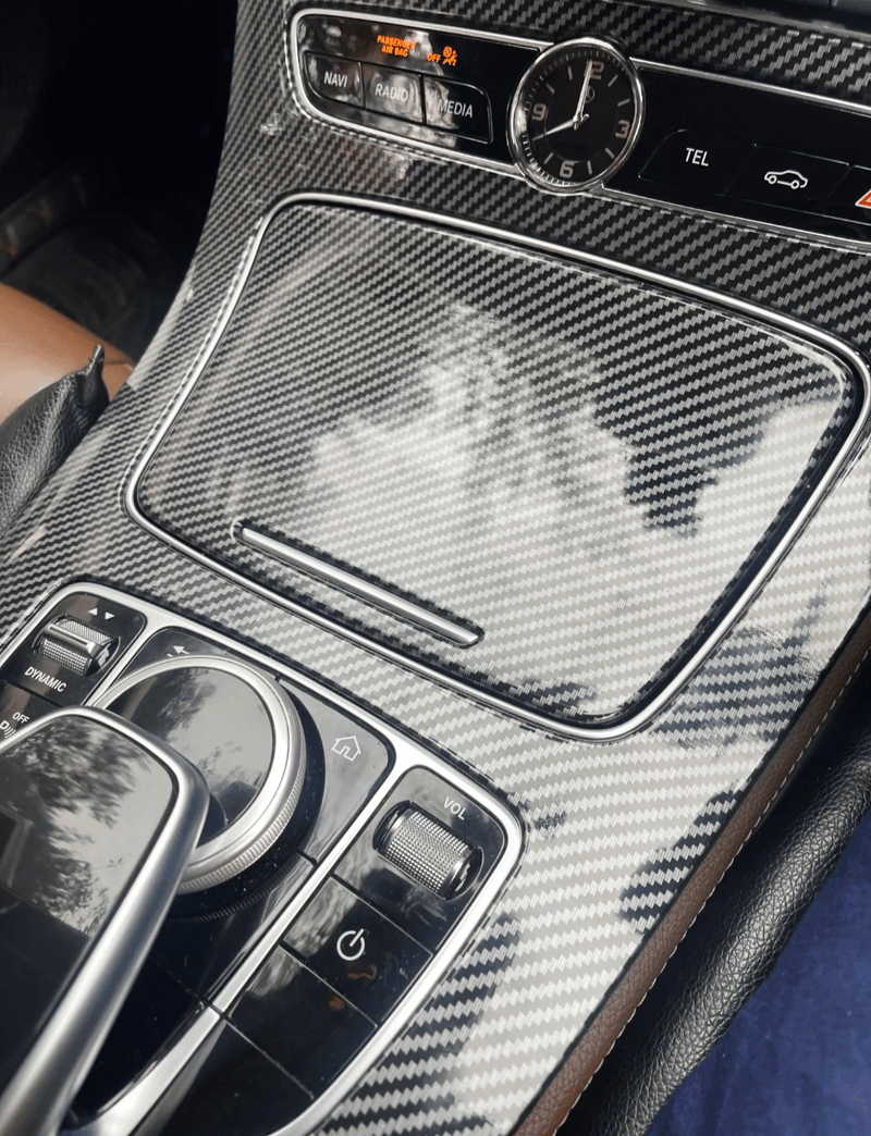 https://cdn.shopify.com/s/files/1/0565/4957/2747/files/Garniture-console-centrale-carbone-replica-pour-Mercedes-Classe-E-W213-2016-2018.png?v=1765638440