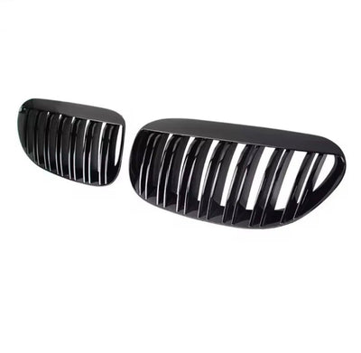 https://cdn.shopify.com/s/files/1/0565/4957/2747/files/Grilles-de-calandre-noires-brillantes-pour-BMW-Serie-6-E63-E64-2003-2010-2.jpg?v=1765146004