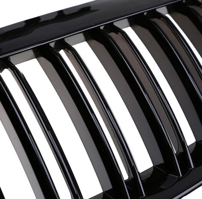 https://cdn.shopify.com/s/files/1/0565/4957/2747/files/Grilles-de-calandre-noires-brillantes-pour-BMW-Serie-6-E63-E64-2003-2010-4.png?v=1765146004
