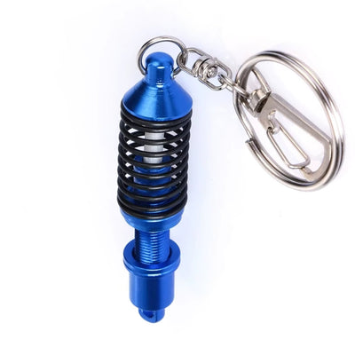 https://cdn.shopify.com/s/files/1/0727/0635/9572/files/PorteCleAmortisseursBleu.jpg?v=1774439672