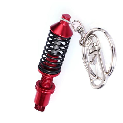 https://cdn.shopify.com/s/files/1/0727/0635/9572/files/PorteCleAmortisseursRouge.jpg?v=1774439672