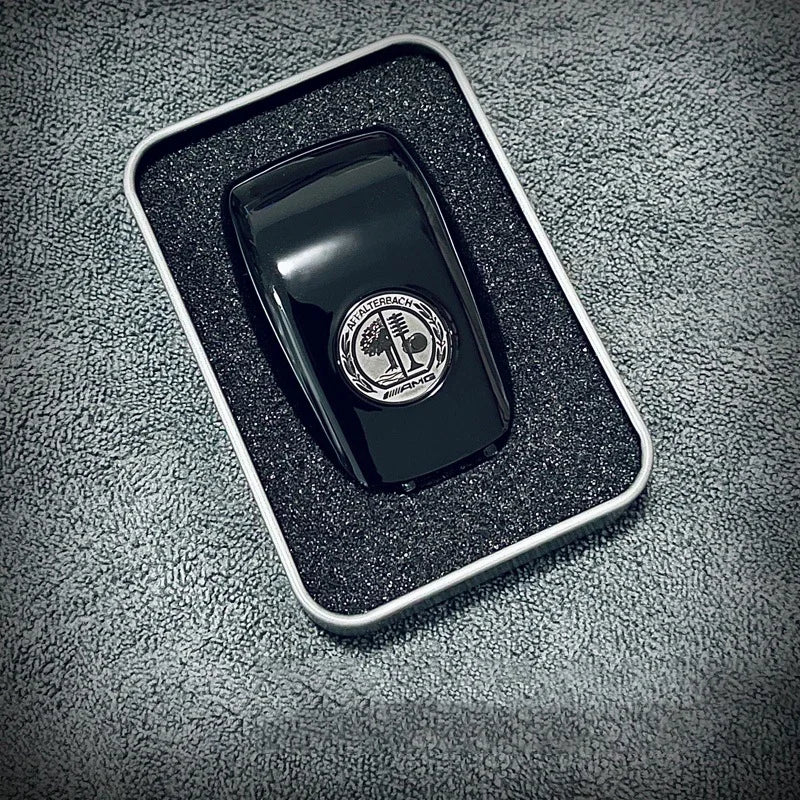 https://cdn.shopify.com/s/files/1/0727/0635/9572/files/Coque_cle_amg_rouge_1.jpg?v=1738087542