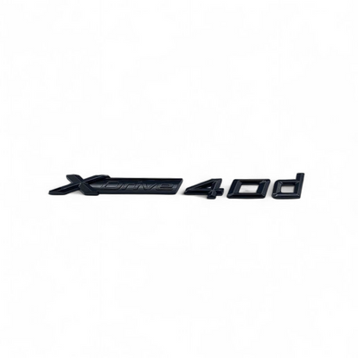 Badge Noir Coffre BMW X6 Xdrive 30d 35i 35d 40i - vue rapprochée - Becquet Voiture