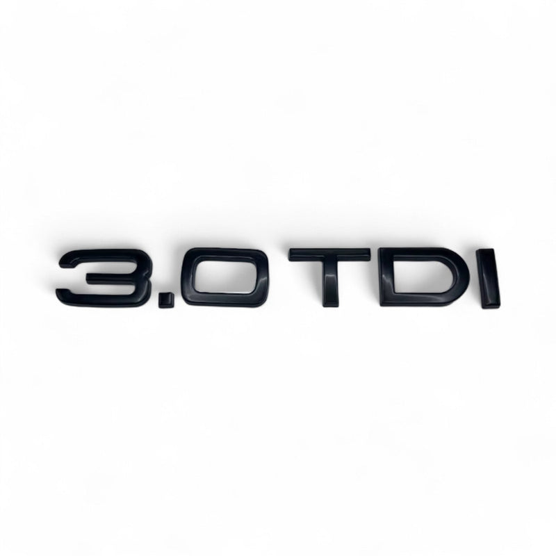 Badges coffre Audi TDI noir brillant - détail du montage - Becquet Voiture