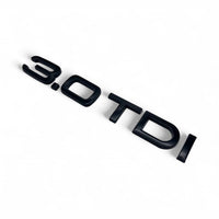 Badges coffre Audi TDI noir brillant - packshot studio - Becquet Voiture