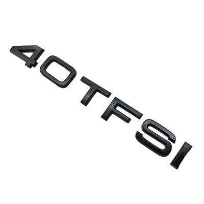 Badges coffre Audi TFSI noir - vue de trois-quarts - Becquet Voiture
