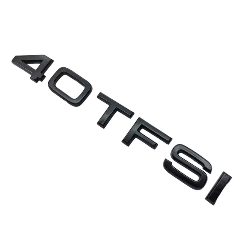 Badges coffre Audi TFSI noir - vue de trois-quarts - Becquet Voiture