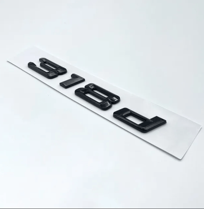 Badges coffre BMW Série 3 noir brillant - vue arrière 3 - Becquet Voiture