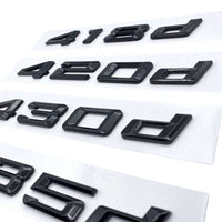 Badges coffre BMW Série 4 noir brillant - vue de dessus - Becquet Voiture