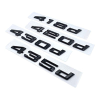 Badges coffre BMW Série 4 noir brillant - vue rapprochée - Becquet Voiture