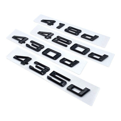 Badges coffre BMW Série 4 noir brillant - vue rapprochée - Becquet Voiture