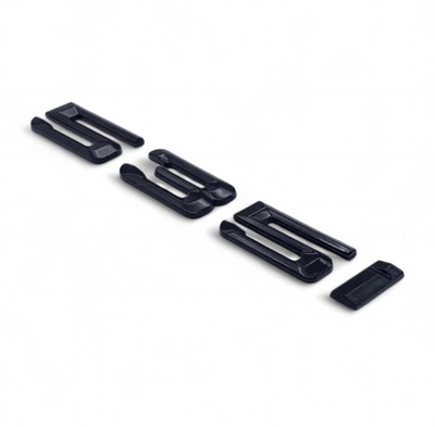 Badges coffre BMW Série 5 noir brillant - vue arrière 3 - Becquet Voiture