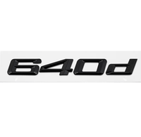 Badges coffre BMW Série 6 noir brillant - vue de profil - Becquet Voiture
