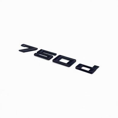 Badges coffre BMW Série 7 noir brillant - détail du montage - Becquet Voiture