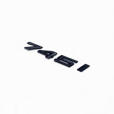 Badges coffre BMW Série 7 noir brillant - packshot studio - Becquet Voiture