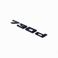 Badges coffre BMW Série 7 noir brillant - vue de face - Becquet Voiture