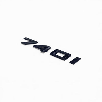 Badges coffre BMW Série 7 noir brillant - vue de trois-quarts - Becquet Voiture