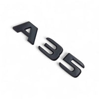 Badges coffre noirs Mercedes A45s A35s AMG W177 kit emblèmes - vue de face - Becquet Voiture