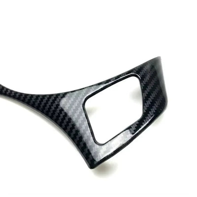 https://cdn.shopify.com/s/files/1/0565/4957/2747/files/bmw_serie_3_e90_volant_carbone4.jpg?v=1765804095