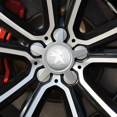 Centre de Roues Peugeot 56mm 60mm Noir Chrome - vue de profil - Becquet Voiture