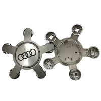 Centre Roue Audi 5 Branches 4F0601165 Logo Anneaux Noir Chrome - détail du montage - Becquet Voiture