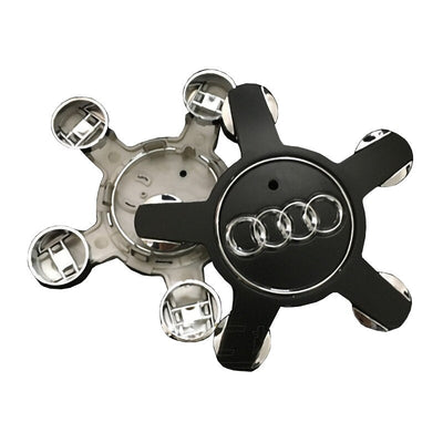 Centre Roue Audi 5 Branches 4F0601165 Logo Anneaux Noir Chrome - packshot studio - Becquet Voiture