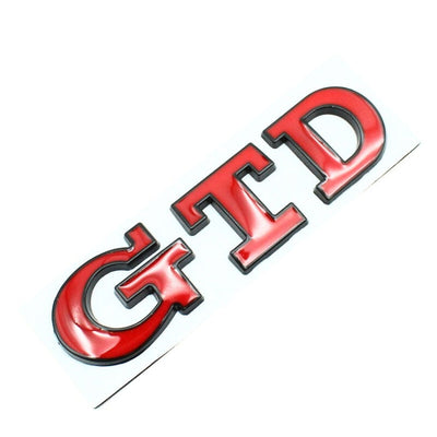 Emblème Badge GTD VW Golf 5 6 7 Avant Arrière - vue de trois-quarts 2 - Becquet Voiture