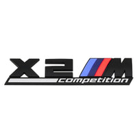 Emblème Badge Logo BMW M Competition Noir Chrome - vue de dessus 2 - Becquet Voiture