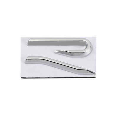 Emblème Badge R Golf 8 Nouvelle Génération - vue rapprochée - Becquet Voiture