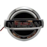 Dynamic Illuminated Nissan LED Grille Emblem 12V - three-quarter view - Becquet Voiture