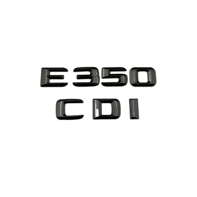 Emblèmes coffre noirs Mercedes Classe E badges arrière - packshot studio - Becquet Voiture