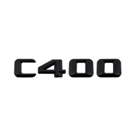 Emblèmes De Coffres Noirs Logos Mercedes Classe C AMG C180 - vue de face 2 - Becquet Voiture