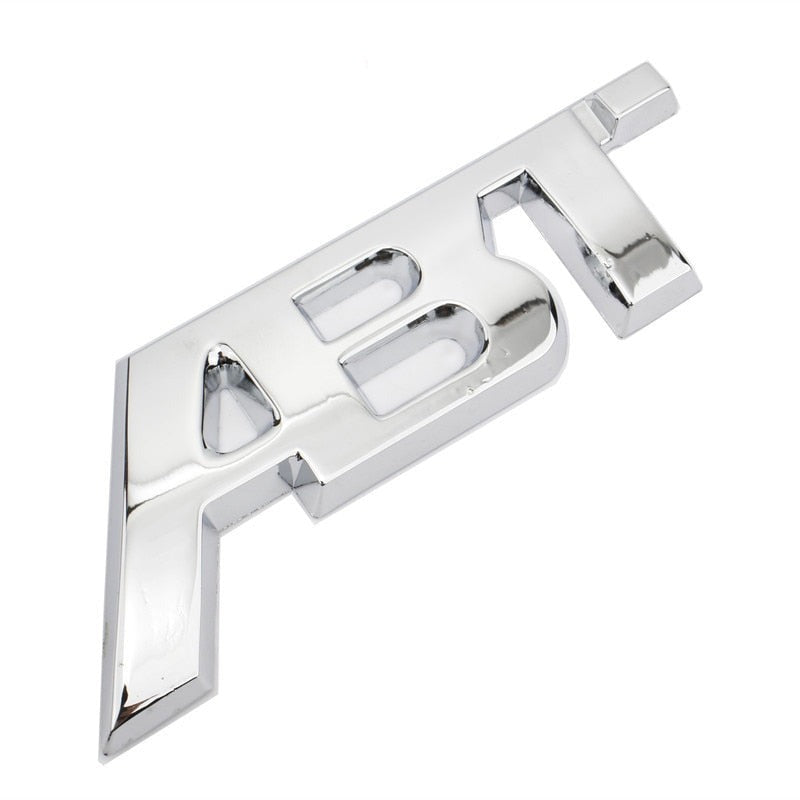 Logo ABT Badge Autocollant Calandre Audi VW - vue de trois-quarts - Becquet Voiture