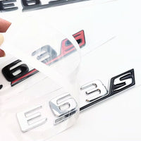 Logo AMG E43 E53 E63S Classe E W213 W214 - vue de trois-quarts - Becquet Voiture