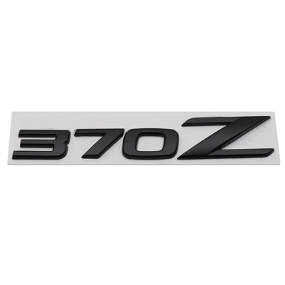 Logo Emblème Nissan 350Z 370Z Fairlady Noir Chrome - vue de face 2 - Becquet Voiture