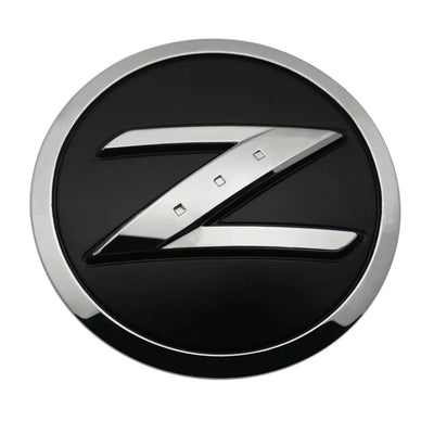 Logo Emblème Nissan 350Z 370Z Fairlady Noir Chrome - vue de profil - Becquet Voiture