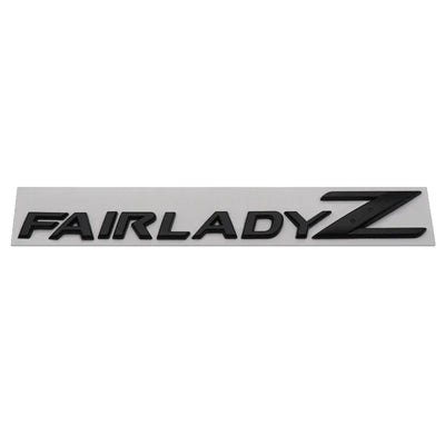 Logo Emblème Nissan 350Z 370Z Fairlady Noir Chrome - vue de trois-quarts 2 - Becquet Voiture