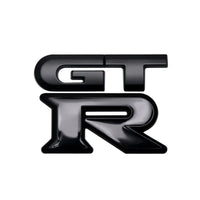 Logo Nissan GTR Arrière Noir Rouge Chrome - vue de profil - Becquet Voiture