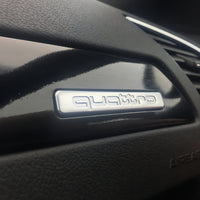 Logo Quattro Audi Emblème Intérieur Plusieurs Tailles - vue arrière - Becquet Voiture