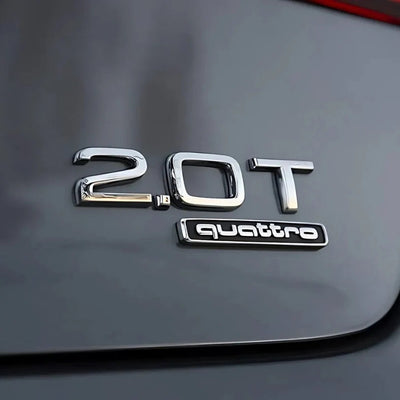 Logo Quattro Audi Emblème Intérieur Plusieurs Tailles - vue de trois-quarts - Becquet Voiture