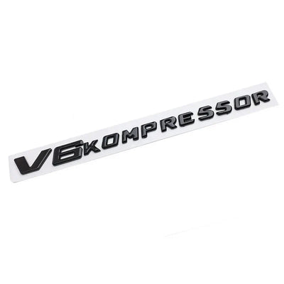Logo V6 V8 Kompressor Mercedes Noir Chrome - détail du montage - Becquet Voiture
