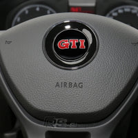 Logo Volant Aluminium VW Golf 5 6 7 GTI R - en situation - Becquet Voiture