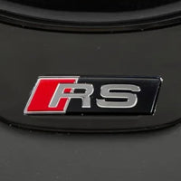 Black Audi B8 S-Line RS Steering Wheel Badge - front view - Becquet Voiture