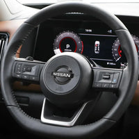 Nissan Steering Wheel Logo 52mm 56mm Black Chrome - fitted on vehicle - Becquet Voiture