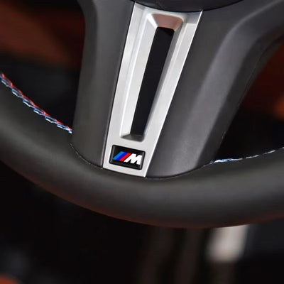 https://cdn.shopify.com/s/files/1/0727/0635/9572/files/logo_M_volant_bmw.jpg?v=1760908438