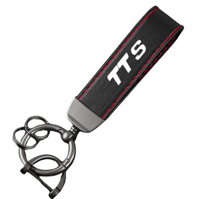 Porte Clé Audi Logo Métal Noir Modèles Variés - en situation 2 - Becquet Voiture